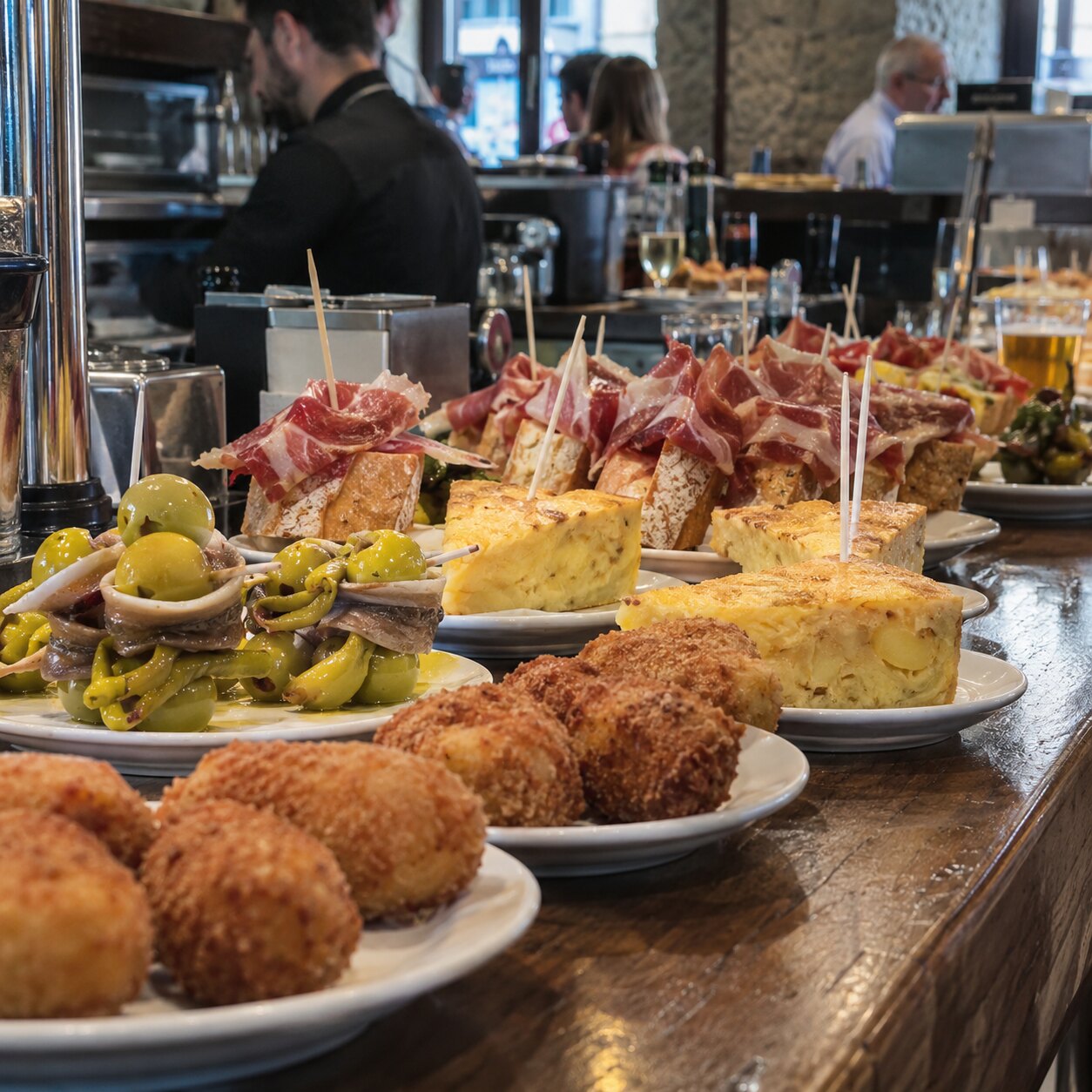 A spread of pintxos and raciones on the bar at G cafe Bilbao